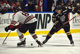 Conor Shortall of the Cape Breton Eagles, right, works his way by Drew Maddigan of the Drummondville Voltigeurs during Quebec Major Junior Hockey League action at Centre 200 in Sydney on Saturday. Shortall and the Eagles will host the Moncton Wildcats at 7 p.m. today. It will be the team’s final home game before the Christmas break. JEREMY FRASER • CAPE BRETON POST