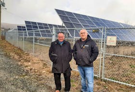 Steve Parsons, left, general manager of Eskasoni's corporate division, and Bertram Bernard Sr., band councillor and chairperson of Eskasoni Corporate, stand in front of the solar photovoltaic system next to Essissoqnikewey Siawa'sik-l'nuey Kina’matinewo’kuo’m, the Mi'kmaw immersion school. ARDELLE REYNOLDS/CAPE BRETON POST