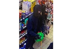 Police described the suspect of an armed gas station robbery in Hunter River as standing around five feet 10 inches tall, with a slim build. At the time of the theft, the man was wearing a dark-coloured hooded sweater.  