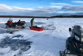 Some of the searchers on the frozen Churchill River near Happy Valley-Goose Bay where a young man saw what he thinks was a body under the ice. 