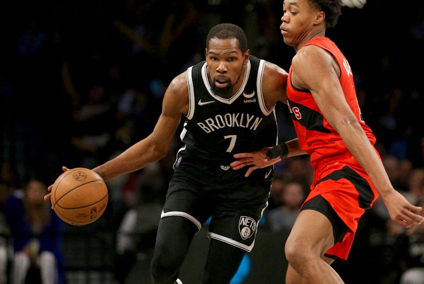 Nets forward Kevin Durant (7) controls the ball against Raptors forward Scottie Barnes (4) during the fourth quarter at Barclays Center. 