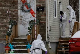 FOR NEWS STORY:
Members of the Forensics Identification Service of the HRP,  walk towards a Kennedy Drive home as they investigate the scene of a suspicious death in Dartmouth Thursday December 16, 2021.

TIM KROCHAK PHOTO