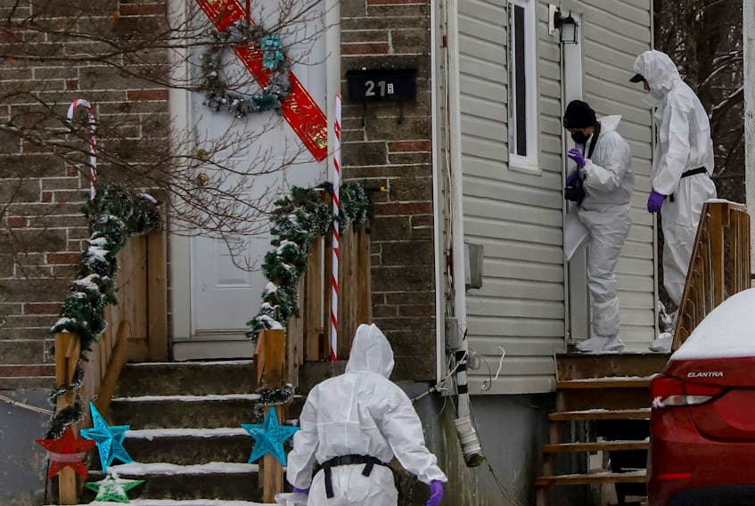 Forensic officers investigate a suspicious death at a home on Kennedy Drive in Dartmouth on Dec. 16, 2021. The death of Vincent Lamont Beals was ruled a homicide.
