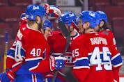 Montreal Canadiens' Artturi Lehkonen, second from left, is congratulated by teammates after goal against the Philadelphia Flyers during first period at the Bell Centre on Thursday, Dec. 16, 2021.
