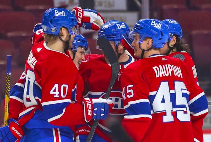 Montreal Canadiens' Artturi Lehkonen, second from left, is congratulated by teammates after goal against the Philadelphia Flyers during first period at the Bell Centre on Thursday, Dec. 16, 2021.
