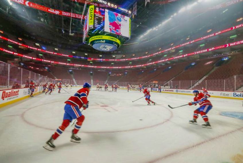 Montreal Canadiens warm up in the empty Bell Centre prior to their game against the Philadelphia Flyers on Thursday, Dec. 16, 2021.