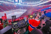 Disc jockey Vincent Aubry prepares to work in the empty Bell Centre prior to the Montreal Canadiens game against the Philadelphia Flyers on Thursday, Dec. 16, 2021.