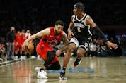  Fred VanVleet of the Raptors dribbles against David Duke Jr. of the Brooklyn Nets during overtime at Barclays Center on Dec. 14, 2021. SARA STIER/GETTY IMAGES
