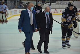 Charlottetown Islanders general manager and head coach Jim Hulton, left, and associate coach and assistant general manager Guy Girouard walk towards the dressing room during a recent Quebec Major Junior Hockey League game at Eastlink Centre. Hulton, Girouard and the Islanders’ management team will be looking to the future next week as the QMJHL trade period reopens on Dec. 19 and runs until Jan. 6. 
