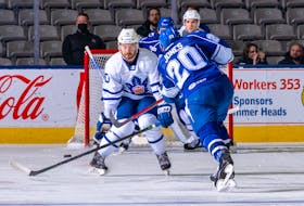 Toronto Marlies forward Zach O’Brien (10) looks to block a shot by Syracuse Crunch defenceman Ryan Jones during an AHL game in Toronto Wednesday. O’Brien is one of seven players recalled from the ECHL’s Newfoundland Growlers to the AHL this week after the Growlers had three road games against the Adirondack Thunder postponed because of a COVID outbreak on the Thunder. The Growlers don’t play again until Dec. 29. — Toronto Marlies photo/Christian Bonin/TSGphoto.com