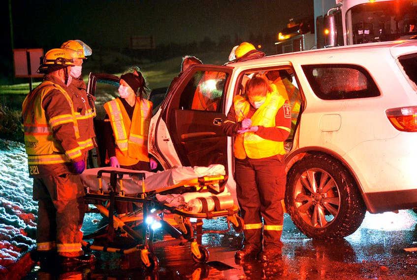 A man was taken to hospital after his SUV plunged from an overpass to the road below Friday night near Mount Pearl. Keith Gosse/The Telegram