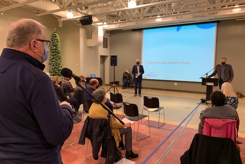 Don Tabor, a member of the Save Our Services committee, asks Nova Scotia Health northern zone medical executive director Dr. Aaron Smith a question about the future of All Saints Hospital in Springhill during a public meeting on Wednesday night.