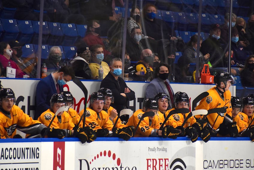 The Cape Breton Eagles are searching for a new head coach after Jake Grimes, behind the bench, middle, stepped down from his position with the team on Tuesday. The team intends to start actively searching for a new head coach next week. JEREMY FRASER • CAPE BRETON POST