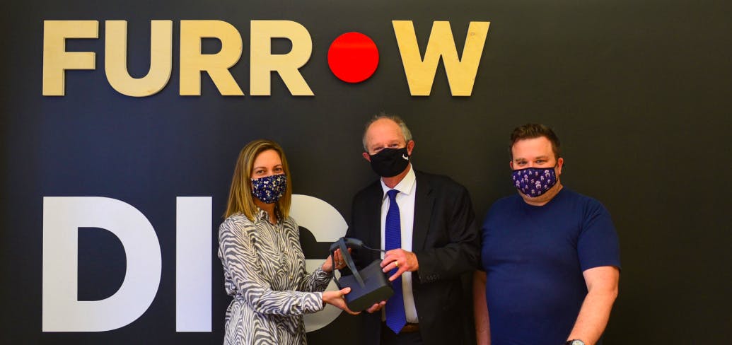Dr. Megan Miller, chief physician recruiter of the medical society of P.E.I., left, Health Minister Ernie Hudson and Craig Harris, owner of Furrow Media, show off new virtual reality headsets that will offer physicians a tour of Island health facilities. 