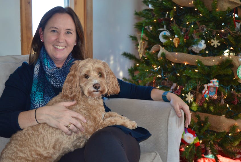 Kelly McEntee, 42, of Brackley, P.E.I., said the decision to go for an early mammogram this year probably saved her life. She was diagnosed with early stage breast cancer in February, had a lumpectomy in March and is now cancer free. McEntee is pictured here with her four-year-old cockapoo, Millie.