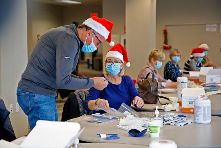 FOR DEMONT STORY:
Volunteers put together COVID19 rapid tests, that will be given to children in area schools, in Dartmouth December 2, 2021. The goal is to make 20,000 kits....SEE STORY FOR MORE DETAILS

TIM KROCHAK PHOTO