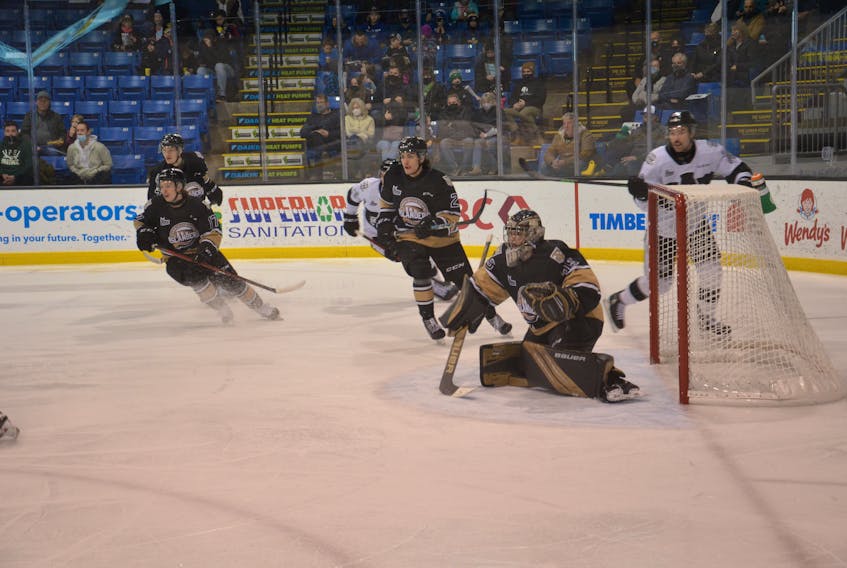 Charlottetown Islanders goaltender Jacob Goobie and forward Sam Oliver, 17, follow the play during a Quebec Major Junior Hockey League game against the Blainville-Boisbriand Armada at Eastlink Centre on Nov. 28. Goobie and Oliver were traded to the Drummondville Voltigeurs on Dec. 19.