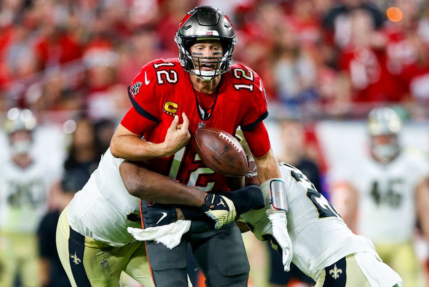 Tampa Bay Buccaneers quarterback Tom Brady (12) fumbles the ball in the second half against the New Orleans Saints at Raymond James Stadium on Dec. 19, 2021.  