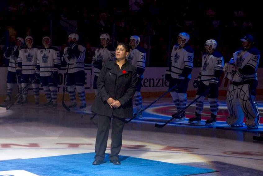  Angela James stands on centre ice in front of the Toronto Maple Leafs team after being inducted into the Hockey Hall of Fame before Toronto Maple Leafs and Buffalo Sabres NHL hockey action in Toronto on Saturday November 6, 2010.