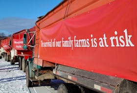 Potato trucks at a Dec. 20 rally at the Charlottetown Event Grounds had signs hanging from them with information about the current potato ban and the issues it is causing Island farmers.