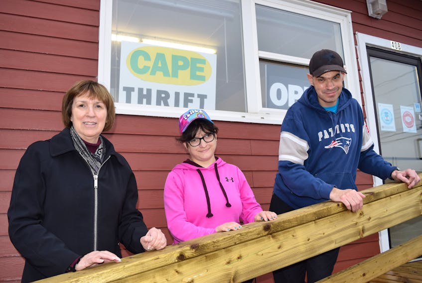 Kim Bedecki, left, executive director of the Centre for Adults in Progressive Employment (CAPE), stands in front of the new CAPE Thrift Store which recently opened at 40 B McKeen St., Glace Bay, with centre participants Charlotte Gwynn, centre, and John Campbell. Bedecki said with the lack of stores in the community this was needed, but most importantly it also provides a great training program in a retail setting for their participants. Sharon Montgomery-Dupe • Cape Breton Post 