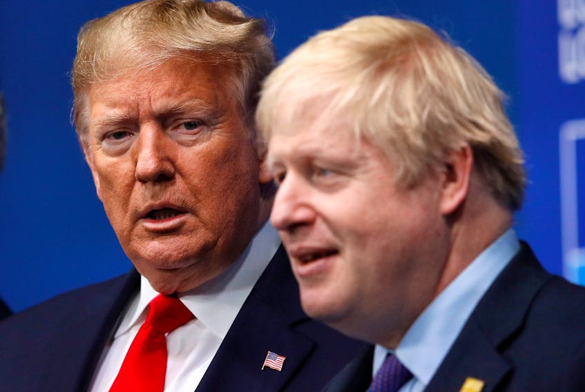 Former U.S. President Donald Trump (left) and British Prime Minister Boris Johnson are exactly the right kind of enemies for their political opponents in their home countries, Gwynne Dyer writes. — Reuters file photo