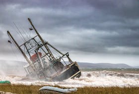 The forces of nature were hard at work in this photo from October, as waves beat against the Northern Tip, a Newfoundland fishing vessel that broke from its mooring at the Iona wharf. Contributed • Gord Osmond