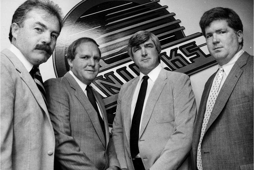 September 11 1987. Vancouver Canucks mean management machine.  Jack McIlhargey (left), Bob McCammon, Pat Quinn and Brian Burke. Greg Osadchuk / Files