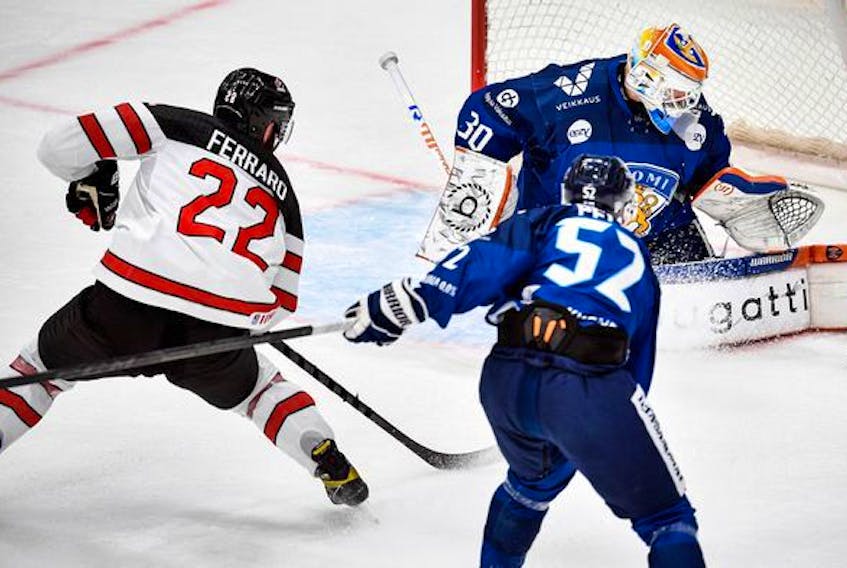  Canada’s Landon Ferraro  attacks the net of Finland’s goalie Christian Heljanko during the Channel One Cup of the Euro Hockey game between Canada and Finland at CSKA Arena in Moscow last weekend.