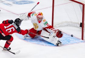 Team Canada’s Connor Bedard (16) scores on Team Russia’s goalie Yegor Guskov (29) during third period of IIHF World Junior Championship exhibition play at Rogers Place in Edmonton, on Thursday, Dec. 23, 2021. 