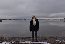 Cheryl Paynter, an organizer with the annual P.E.I. Polar Bear Dip, stands on the beach area on Dec. 28, 2021, near the Charlottetown Yacht Club where participants usually jump into the frigid water on New Year's Day. For the second year in a row, the event has been cancelled due to COVID-19. 