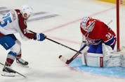 Montreal Canadiens goaltender Jake Allen stops shot by Colorado Avalanche's Logan O'Connor (25) during first period action in Montreal on Thursday, Dec. 2, 2021.