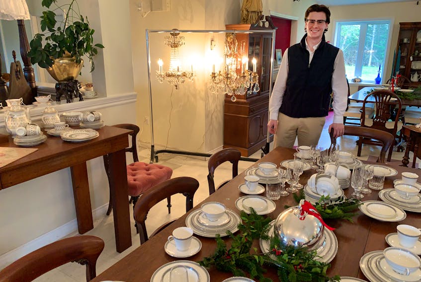 Sandy Hiltz with a dining room table and 126-piece set of Royal Doulton china. Dec 2, 2021
