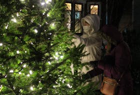 A tree was lit outside the Colchester East Hants Hospice on Thursday, and people were invited to hang angel ornaments. 