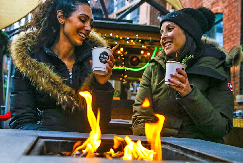  People get into the holiday spirit at the Christmas Market at Toronto’s Distillery District.