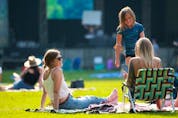  Music fans take in the first night of the Calgary Folk Music Festival’s Summer Serenades Concert Series at PrinceÕs Island on July 22, 2021. Unlike a regular festival, there is one stage and designated areas for tarps with social distancing. Gavin Young/Postmedia