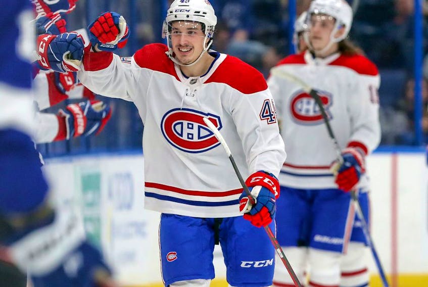Quebec native and Canadiens seventh-round draft pick Rafael Harvey-Pinard celebrates scoring a goal in his NHL debut Tuesday night in Tampa. 