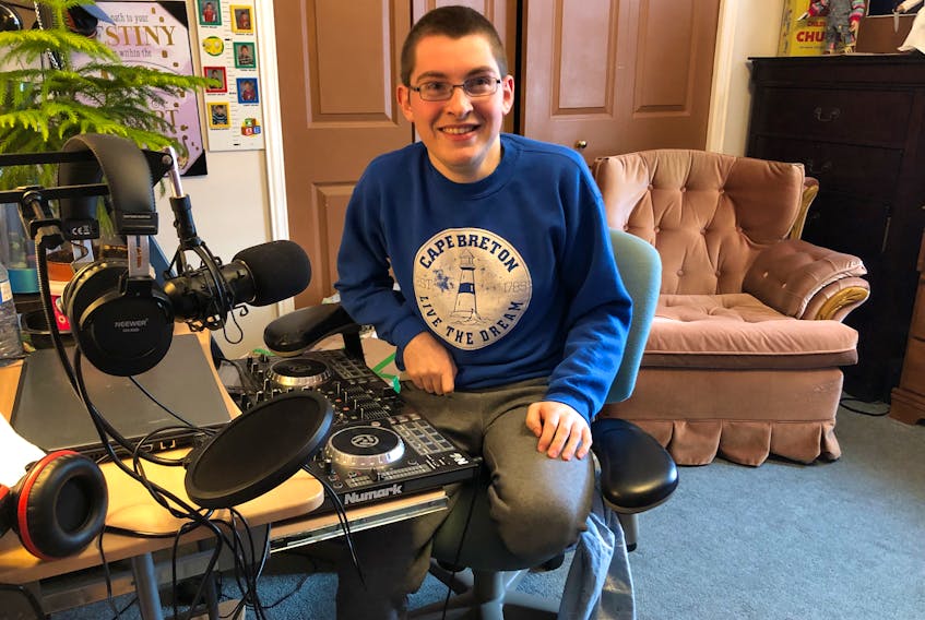Kenny Boutilier sits at the deejay set up he has in his room which he used to use for his online radio show. The 20-year-old, who was non-verbal as a child, still deejays events and has big plans for his future which includes working as a teaching assistant and becoming a foster parent. NICOLE SULLIVAN/CAPE BRETON POST 