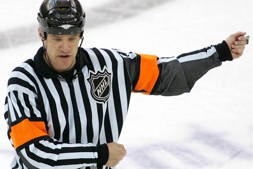 Referee Dave Jackson calls a hooking penalty during a playoff  game between the New York Rangers and the New Jersey Devils on April 11, 2008, at the Prudential Center in Newark, N.J.