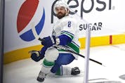  Canucks winger Conor Garland celebrates his goal against the Seattle Kraken during the Kraken’s inaugural NHL home game at Climate Pledge Arena on Oct. 23.