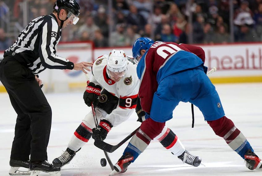 Josh Norris of the Senators faces off against Nazem Kadri of the Avalanche in the third period of the Nov. 22 game in Denver.