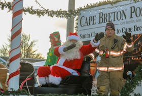 Santa Claus waves to the crowd at the Glace Bay Santa Claus parade on Saturday afternoon. JESSICA SMITH/CAPE BRETON POST