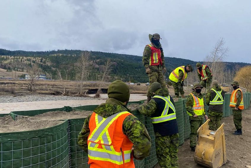 Members of the Canadian Armed Forces continue Hesco container construction along a section of the Coldwater River in Merritt on Dec. 1, 2021.