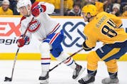 Canadiens' Nick Suzuki (14) scores against the Predators at Bridgestone Arena in Nashville on Saturday, Dec. 4, 2021.