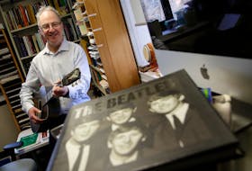 FOR DEMONT STORY:
Dalhousie University math professor and Beatles fan Jason Brown is shown in his office on the Halifax campus on Friday.
TIM KROCHAK/THE CHRONICLE HERALD