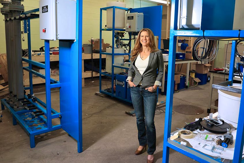 Amanda Hall, CEO of Summit Nanotech, stands in one of her company's green lithium extraction labs in Calgary on Sunday, December 5, 2021. Hall was announced as the $1-million grand prize winner of the Impact Canada Women in Cleantech Challenge.