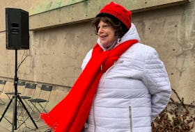 Dressed in a red scarf to identify that she is a descendant of survivors, Rowena Mahar attended a ceremony on Monday, Dec. 6, 2021 at Fort Needham Memorial Park in Halifax to commemorate the Halifax Explosion which happened 104 years ago.