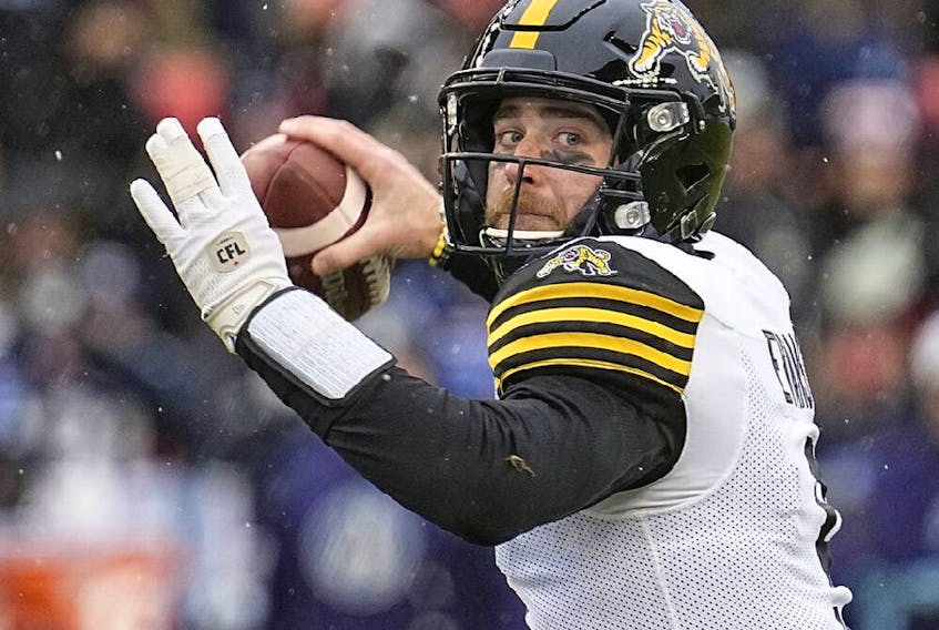 Hamilton Tiger-Cats quarterback Dane Evans (9) passes against the Toronto Argonauts during the first half of the Canadian Football League Eastern Conference Final game at BMO Field.  