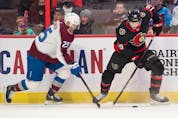  Ottawa Senators right wing Drake Batherson (19) battles with Colorado Avalanche right wing Logan O’Connor (25) for control of the puck in the second period at the Canadian Tire Centre.