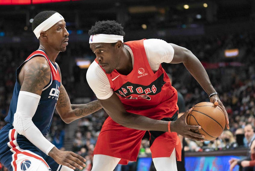 Toronto Raptors forward Pascal Siakam (right) controls the ball as Washington Wizards guard Kentavious Caldwell-Pope (left) tries to defend during yesterday's game at Scotiabank Arena. 